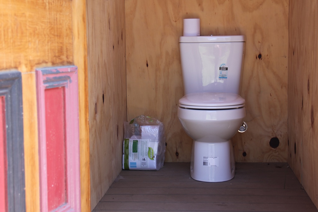 Modern flushing toilet – but outside – Bay Of Fires Eco Hut